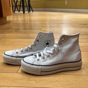 Brand-new custom white platform Converse. Women’s size 7.5. Never worn.